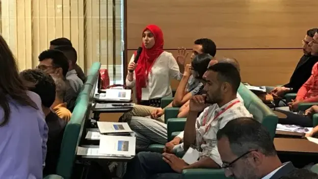 Participants listening to the speaker