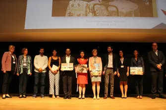 Group picture on stage with the winners