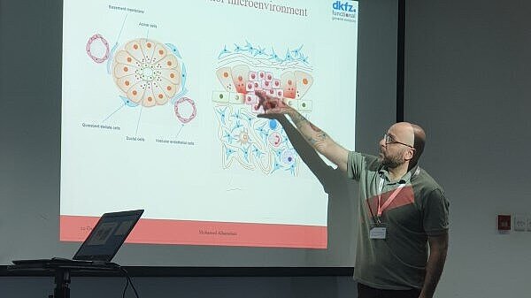 A man explaining something in a presentation pointing with a finger