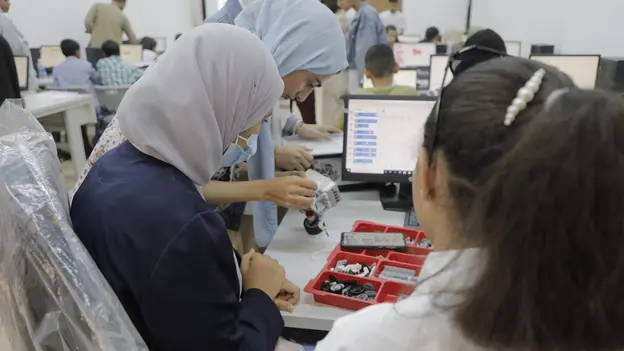 Children building a Lego-Robot