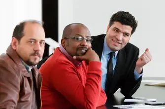 Picture of three men during the conference