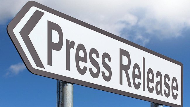 Street sign in arrow shape saying press release