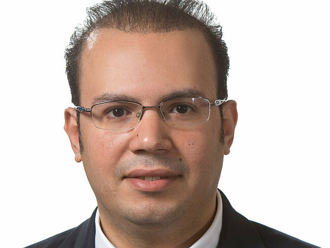 Portrait of Amr Radwan looking into the camera