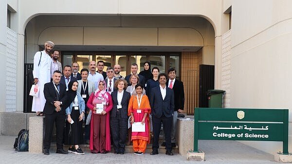 Group picture in front of the College of Science