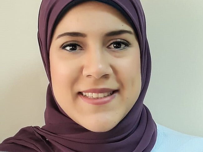Samar Awad looking into the camera